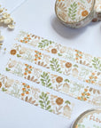Premium Handmade Washi Tape Flower Grid 15mm x 10m - 4 pieces and 4 washi tapes on the table with a white flower branch