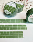 Premium Handmade Washi Tape Forest Grid 15mm x 10m - 3 pieces and 3 washi tapes on the table with a pink flower branch, a heading chapter