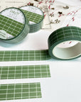 Premium Handmade Washi Tape Forest Grid 15mm x 10m - 3 pieces and 3 washi tapes on the table with a pink flower branch, a heading chapter