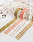 Premium Handmade Washi Tape Gridtastic 15mm x 10m - 4 pieces and 4 washi tapes on the table with a dark maroon flower branch, a chapter heading, a sticker sheet