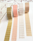 Premium Handmade Washi Tape
Gridtastic 15mm x 10m - 4 pieces and 7 washi tapes on the table with a dark maroon flower branch, a chapter heading