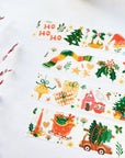 Premium Handmade Washi Tape Happy Holidays 20mm x 10m - 4 pieces on the table with a dark maroon flower branch