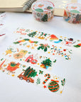 Premium Handmade Washi Tape Happy Holidays 20mm x 10m - 4 pieces and 3 washi tapes on the table with a dark maroon flower branch, a notebook