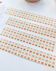 Premium Handmade Washi Tape Warm Heart 15mm x 10m - 4 pieces on the table with a dark maroon flower branch