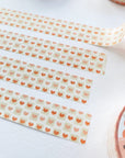 Premium Handmade Washi Tape Warm Heart 15mm x 10m - 4 pieces and 2 washi tapes on the table
