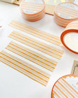 Premium Handmade Washi Tape Warm Line 15mm x 10m - 4 pieces and 4 washi tapes on the table with a dark maroon flower branch