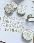 Premium Handmade Washi Tape Wild Leaf 15mm x 10m - 4 pieces and 5 washi tapes on the table with 2 white flower branches, a notebook