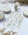 Premium Handmade Washi Tape Wild Leaf 15mm x 10m - 4 pieces and 5 washi tapes on the table with 2 white flower branches, a notebook