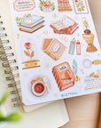 Premium Handmade Sticker Sheet Aesthetic Book 105mm x 148mm - a sheet on the table with a branch, an opened notebook