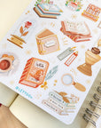 Premium Handmade Sticker Sheet Aesthetic Book 105mm x 148mm - a sheet on the table with an opened notebook
