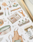 Premium Handmade Sticker Sheet Aesthetic Cozy Kitchen 105mm x 148mm - a sheet on the table with an opened notebook
