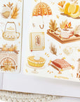 Premium Handmade Sticker Sheet Autumn in my Heart 105mm x 148mm - 2 sheets on the table with an opened notebook
