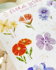 Premium Handmade Sticker Sheet Floral Desire 105mm x 148mm - a sheet on the table with a white flower branch, an opened notebook