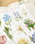 Premium Handmade Sticker Sheet Floral Power 105mm x 148mm - a sheet on the table with a white flower branch, an opened notebook