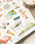 Premium Handmade Sticker Sheet Into The Wild 105mm x 148mm - a sheet on the table with a washi tape, an opened notebook