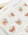 Premium Handmade Sticker Sheet Magic Wings 105mm x 148mm - a sheet on the table