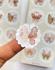 Premium Handmade Sticker Sheet Magic Wings 105mm x 148mm - a piece on the finger and 2 sheets on the table