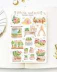 Premium Handmade Sticker Sheet Spring Garden 105mm x 148mm - a sheet on the table with a white flower branch, an opened notebook