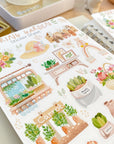 Premium Handmade Sticker Sheet Spring Garden 105mm x 148mm - a sheet on the table with an opened notebook