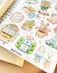 Premium Handmade Sticker Sheet Spring Vibes 105mm x 148mm - a sheet on the table with an opened notebook