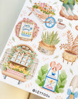 Premium Handmade Sticker Sheet Spring Vibes 105mm x 148mm - a sheet on the table with an opened notebook