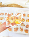 Premium Handmade Sticker Sheet Sweet Pumpkin 105mm x 148mm - a piece on finger and a sheet on the table