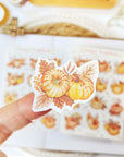 Premium Handmade Sticker Sheet Sweet Pumpkin 105mm x 148mm - a piece on finger and a sheet on the table