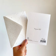 Back of the card with the Panyawan illust mark, FSC paper and the envelope