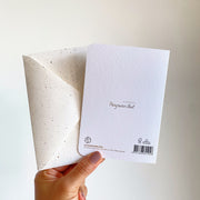 Back of the card with the Panyawan illust mark, FSC paper and the envelope