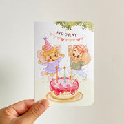Hooray — greeting card held in hand