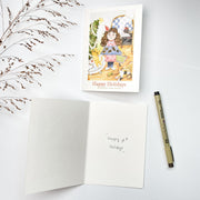 Everything Under Control Christmas card opened, English front with the blank inside and a pen