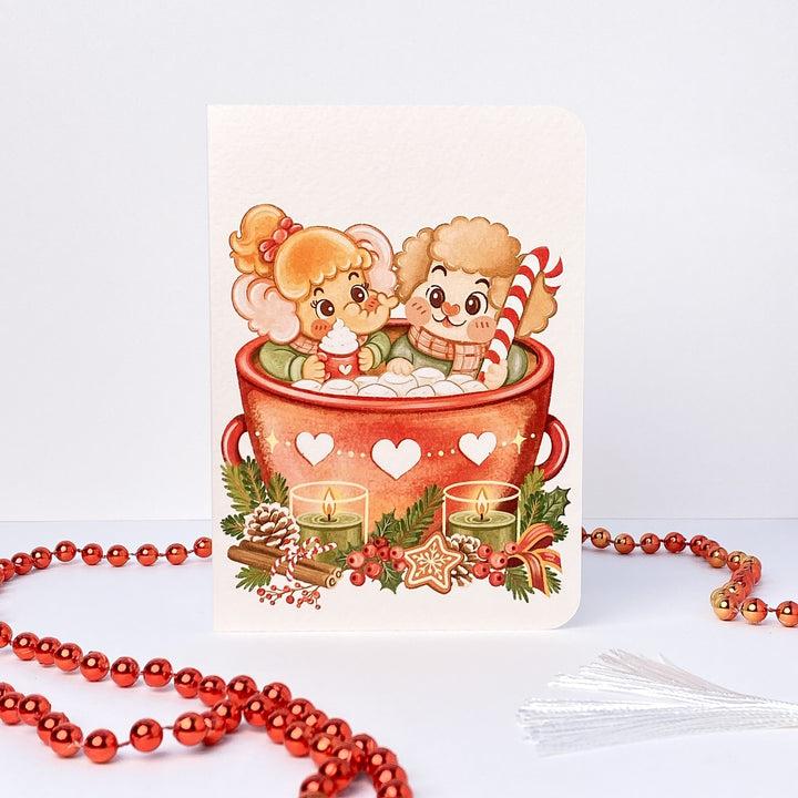 Hot Cacao Christmas card without text: Tuk Tuk the elephant and Stroop the dog in a giant mug of hot cacao
