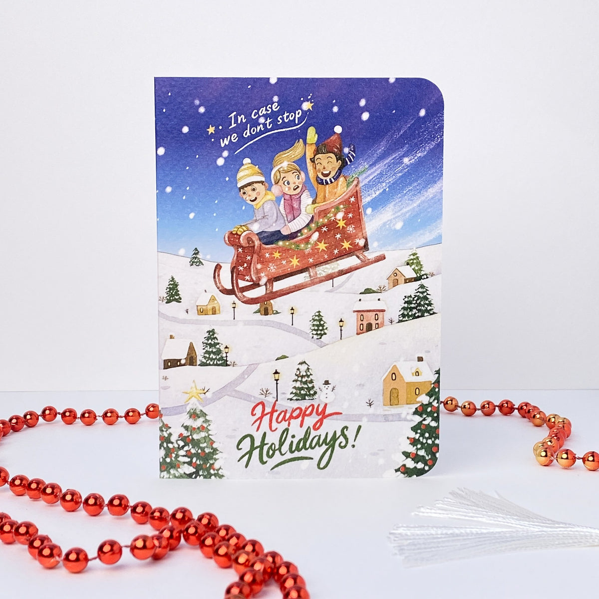 In Case We Don't Stop Christmas card, English front: In case we don't stop, Happy Holidays!
