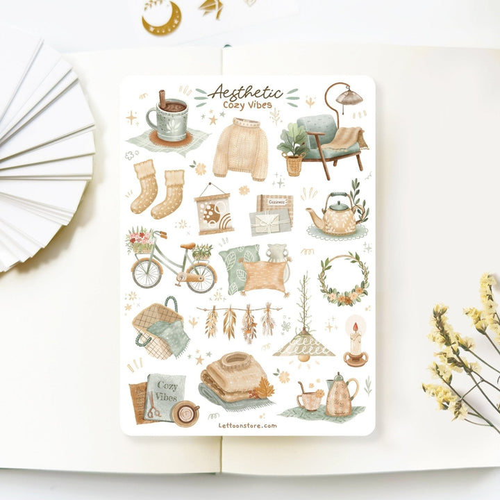 Premium Handmade Sticker Sheet 
Aesthetic Cozy 105mm x 148mm - a sheet on the table with a white flower branch, an opened notebook