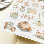 Premium Handmade Sticker Sheet 
Aesthetic Cozy 105mm x 148mm - a sheet on the table with an opened notebook