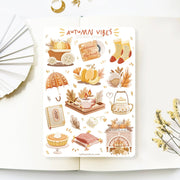 Premium Handmade Sticker Sheet Autumn in my Heart 105mm x 148mm - a sheet on the table with a white flower branch, an opened notebook