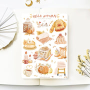 Premium Handmade Sticker Sheet Autumn in my Heart 105mm x 148mm - a sheet on the table with a white flower branch, an opened notebook