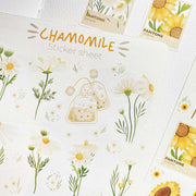 Premium Handmade Sticker Sheet Chamomile Sunflower 105mm x 148mm - a sheet on the table with an opened notebook