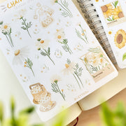 Premium Handmade Sticker Sheet Chamomile Sunflower 105mm x 148mm - a sheet on the table with an opened notebook