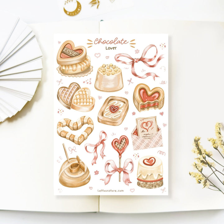 Premium Handmade Sticker Sheet 
Chocolate Lover 105mm x 148mm - a sheet on the table with a white flower branch, an opened notebook