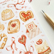 Premium Handmade Sticker Sheet 
Chocolate Lover 105mm x 148mm - a sheet on the table with a dark maroon flower branch, a pencil 