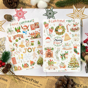 Premium Handmade Sticker Sheet Christmas 105mm x 148mm - 2 sheets on the table with an opened notebook, an acorn, 5 pinecones, 3 stars