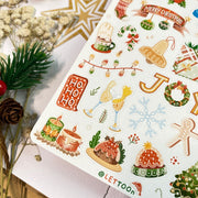 Premium Handmade Sticker Sheet Christmas 105mm x 148mm - a sheet on the table with a white flower branch, an opened notebook, an acorn, a pinecone, a star