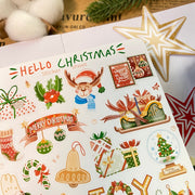 Premium Handmade Sticker Sheet Christmas 105mm x 148mm - a sheet on the table with a white flower branch, an opened notebook, 2 stars