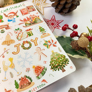 Premium Handmade Sticker Sheet Christmas 105mm x 148mm - a sheet on the table with an opened notebook, an acorn, a pinecone, 2 stars