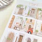 Premium Handmade Sticker Sheet Cozy Doors 105mm x 148mm - a sheet on the table 