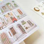 Premium Handmade Sticker Sheet Cozy Doors 105mm x 148mm - a sheet on the table 