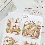 Premium Handmade Sticker Sheet Cozy Hideout 105mm x 148mm - 4 pieces on the table with a pink flower branch