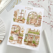 Premium Handmade Sticker Sheet Cozy Hideout 105mm x 148mm - 4 pieces on the table with a pink flower branch