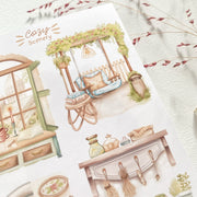 Premium Handmade Sticker Sheet Cozy Scenery 105mm x 148mm - 4 pieces on the table with dark maroon flower branch